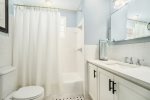 Full bathroom is adjacent to the two queen bedrooms has a washer dryer